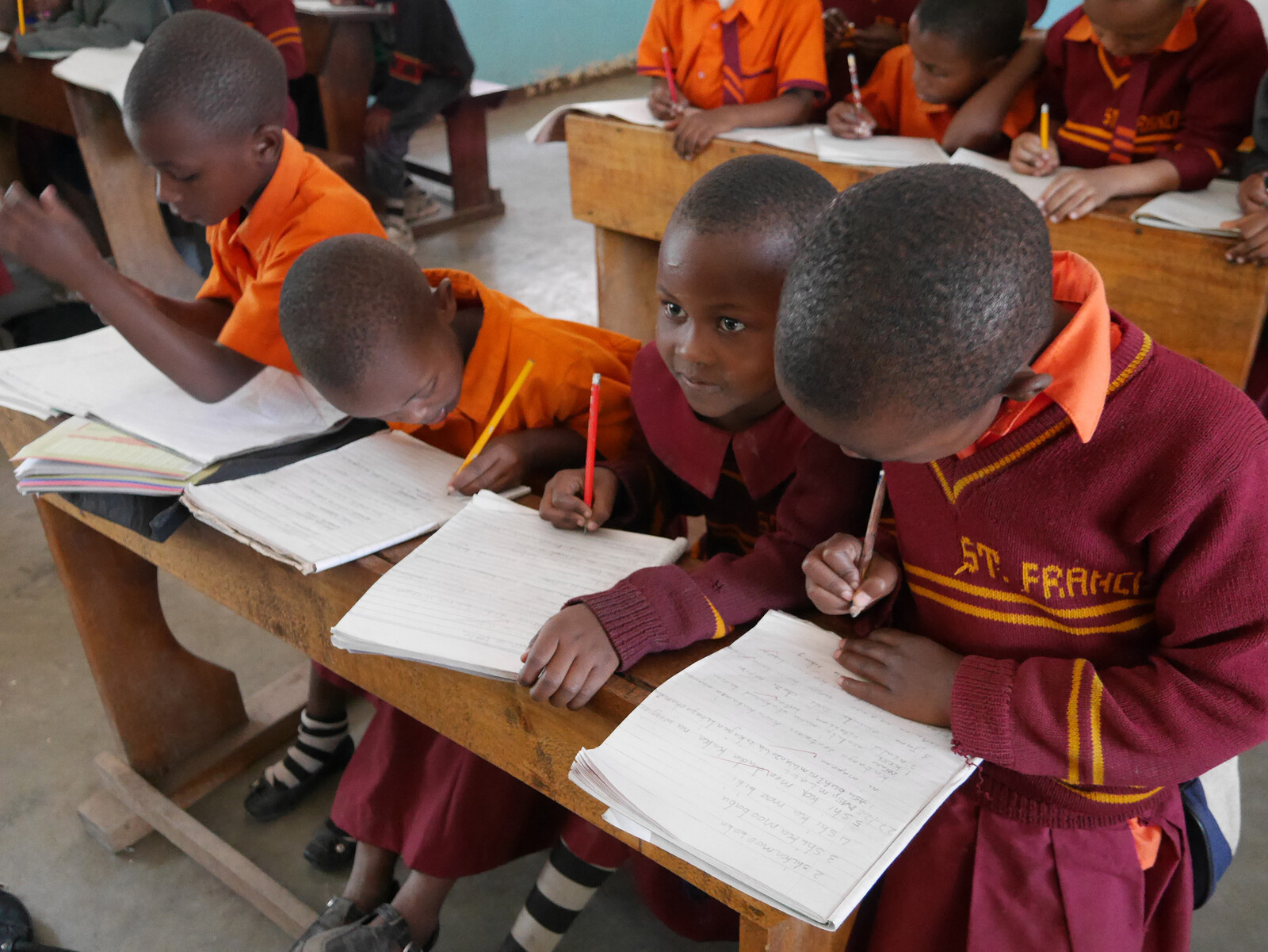 African orphans sit in class at the orphanage in Tanzania. This is supported by the For Smiling Children project, which is co-financed by the Grand Resort Bad Ragaz. The Grand Resort is a star hotel in Switzerland.
